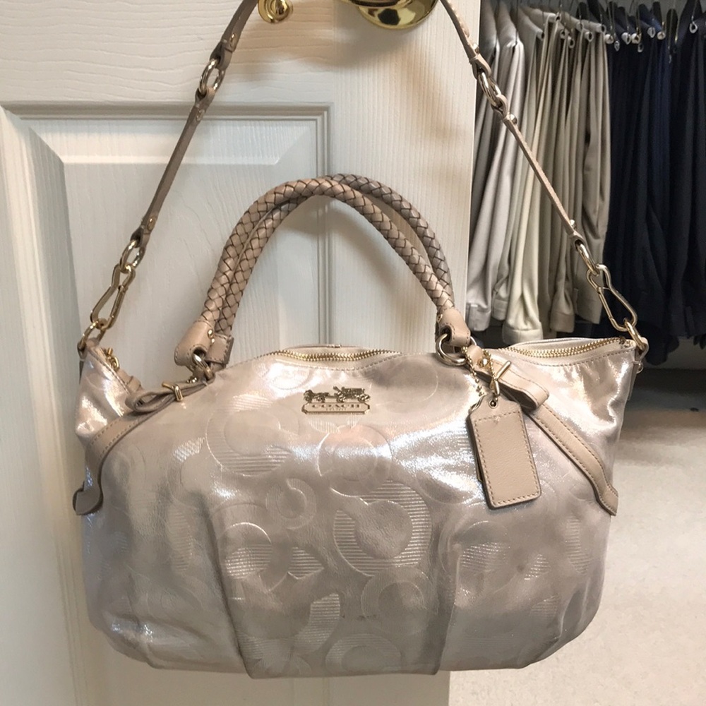 Gently used cream colored Coach purse.